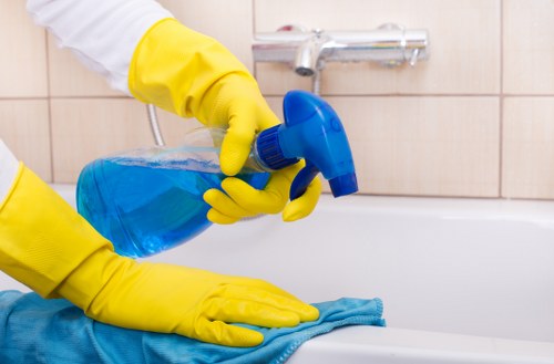 Technician removing dirt from a household sofa