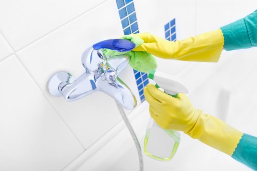 Technician preparing a carpet cleaning solution before work begins