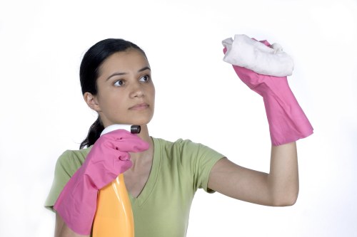 Operative using protective gear during carpet cleaning